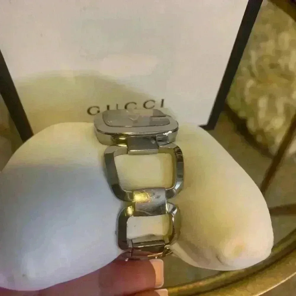 Gucci G watch Silver with Dark Bronze Face With Diamonds.